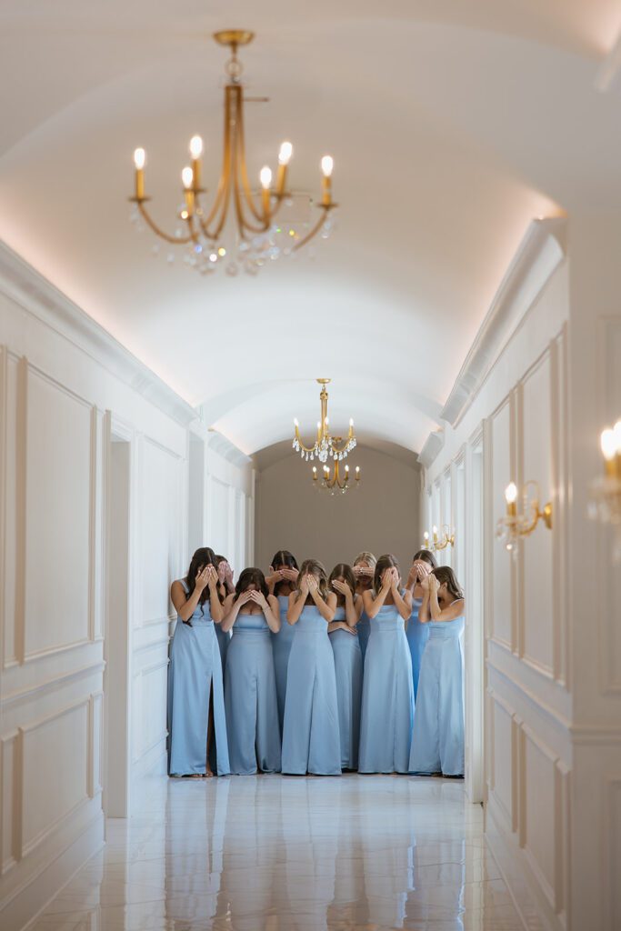 Bridesmaids first look in a hallway of the Hillside Estate