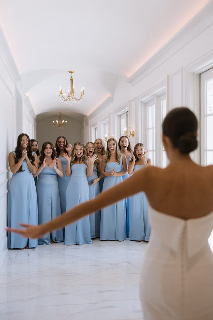 Bridesmaids first look in a hallway of the Hillside Estate