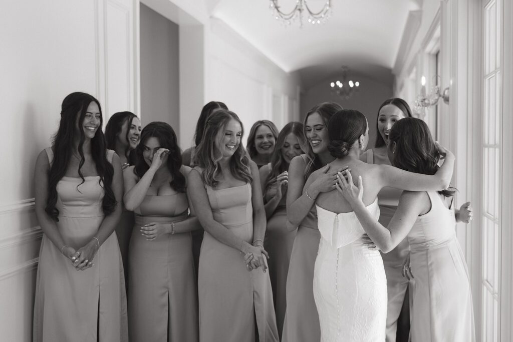 Bridesmaids first look in a hallway of the Hillside Estate